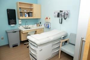 Photo of a hospital bed in a medical room